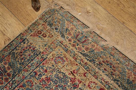 A Caucasian rug with triple medallion on a blue ground and two worn Persian rugs 210 x 120cm, 205 x 135cm and 195 x 145cm
